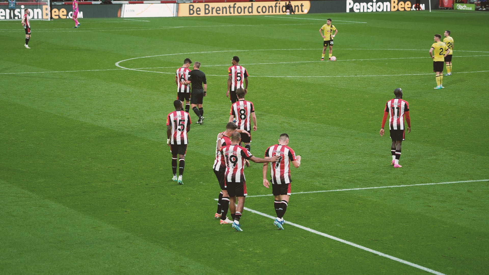 Two up: Brentford’s players head back to their own half following Bryan Mbeumo’s first-time finish
